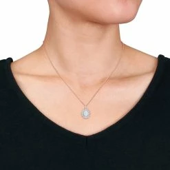 Best Sale 👍 Mimi & Max 2 1/6 CT TGW Oval Shape Blue Ethiopian Opal and White Topaz and Diamond Accent Halo Pendant with Chain in Rose Plated Sterling Silver for 👩 women 💯 8 Best Sale 👍 Mimi & Max 2 1/6 CT TGW Oval Shape Blue Ethiopian Opal and White Topaz and Diamond Accent Halo Pendant with Chain in Rose Plated Sterling Silver for 👩 women 💯 -Mimi & Max Shop e18ee9bd84e944d49b4116731e85a6d6 e2597b6c 7673 409d aa62 c923c24d9997 1080x